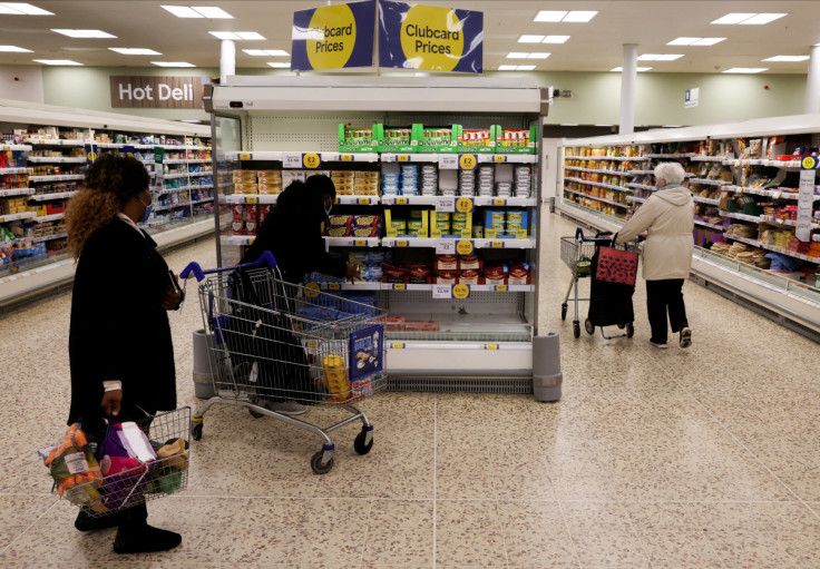 Clubcard branding is seen inside a branch of a Tesco Extra supermarket in London