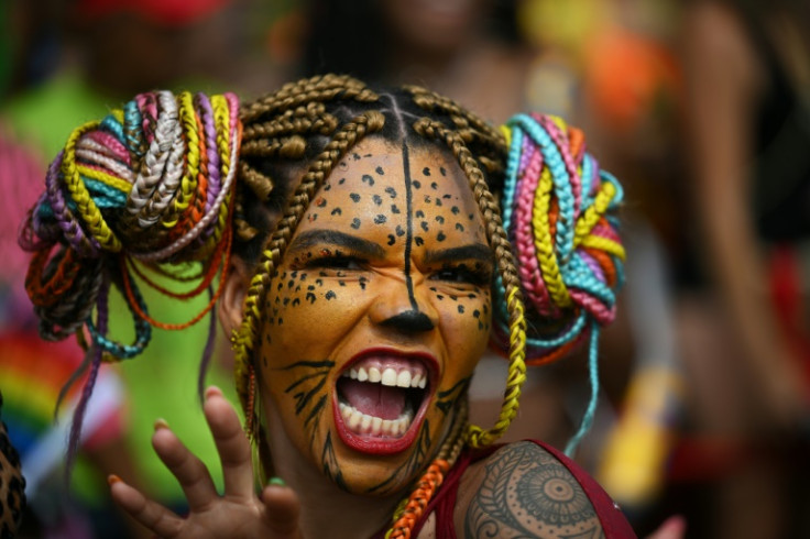 A participant performs during a street party close to Flamengo beach in Rio de Janeiro on February 18, 2023