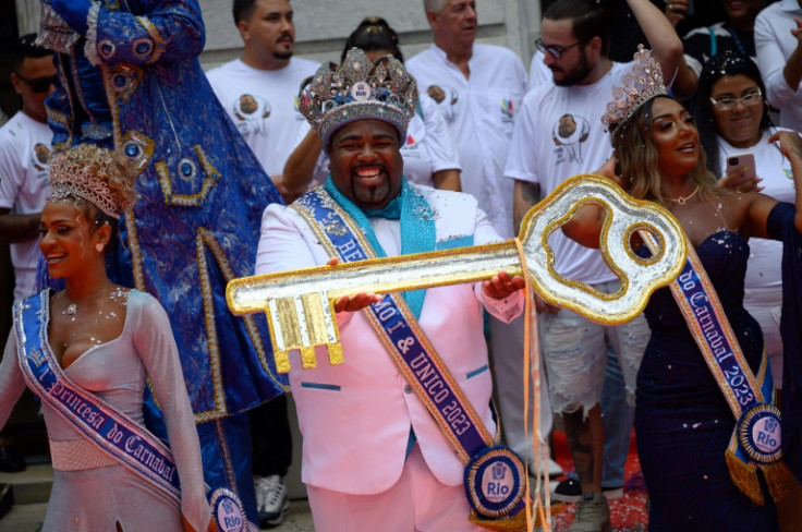 This year's King Momo, Djeferson Mendes da Silva, holds the keys to the city of Rio de Janeiro during the official carnival opening ceremony on February 17, 2023