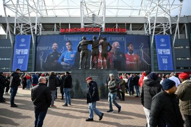 Fans arrive at Old Trafford ahead of Manchester United's match against Leicester amid uncertainty over the future owners of the club