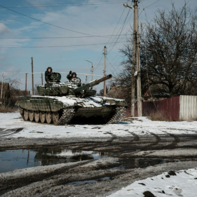 A Ukrainian T-72 main battle tank runs along a street in Siversk in eastern Ukraine