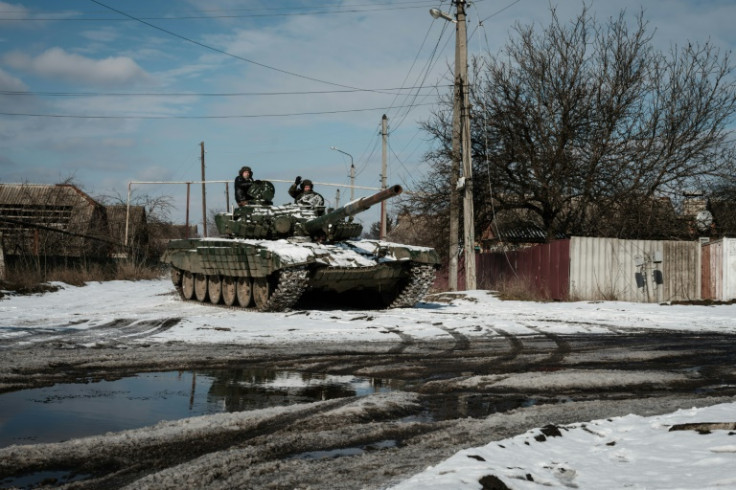 A Ukrainian T-72 main battle tank runs along a street in Siversk in eastern Ukraine