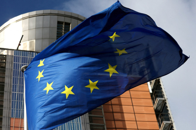 A European Union flag flutters outside the EU Commission headquarters in Brussels