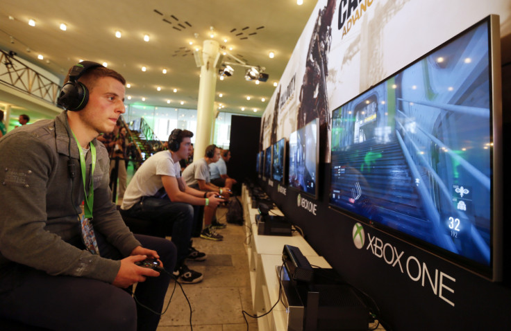 A gamer plays "Call of Duty: Advanced Warfare" on an Xbox One console during the Xbox Play Day 2014, before the Gamescom 2014 fair in Cologne