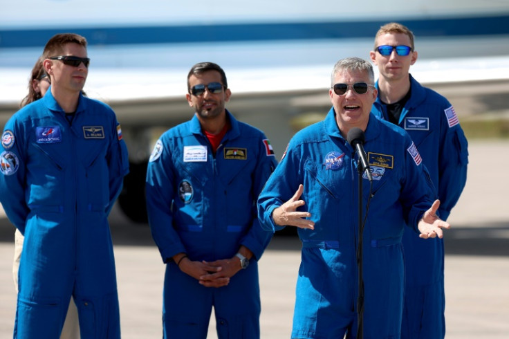 From L-R, Russian cosmonaut Andrey Fedyaev, astronaut Sultan Al-Neyadi of the United Arab Emirates, mission commander Stephen Bowen of NASA and pilot Warren Hoburg of NASA speak to reporters in Cape Canaveral, Florida