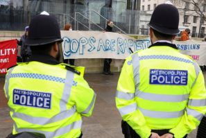 'Raise the Alarm' protest outside New Scotland Yard police headquarters, in London