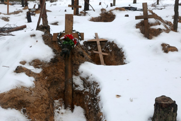 Empty graves after the exhumation of bodies from mass graves dug during the Russian occupation in the town of Izyum