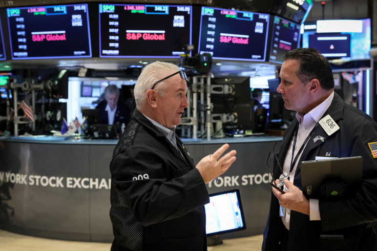 Traders work on the floor of the NYSE in New York