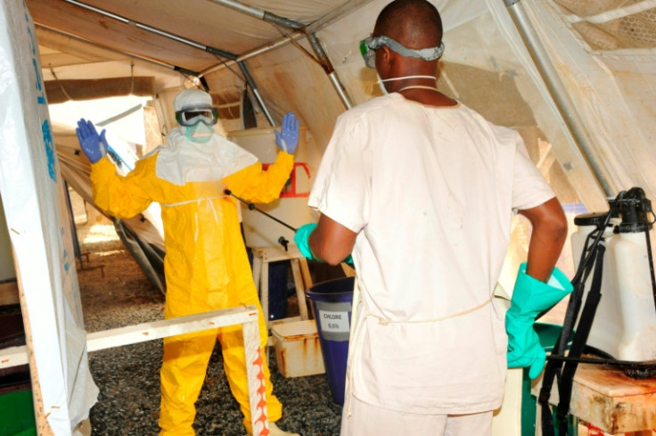 Marburg fever is a close relative of Ebola. Pictured: Medical staff wear protective gear during a deadly Ebola epidemic that struck Guinea in 2015