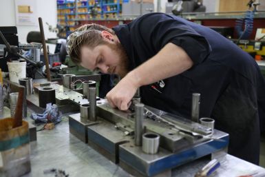 A worker in Brandauer's factory processes new orders as they benefit from the reshoring of manufacturing following global supply chain disruption in Birmingham