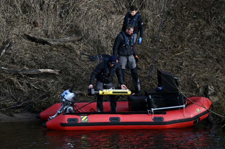 Specialist divers scoured the river for traces of the mother-of-two