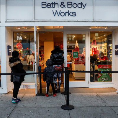 Shoppers wait in line outside a Bath and Body Works retail store in Brooklyn, New York