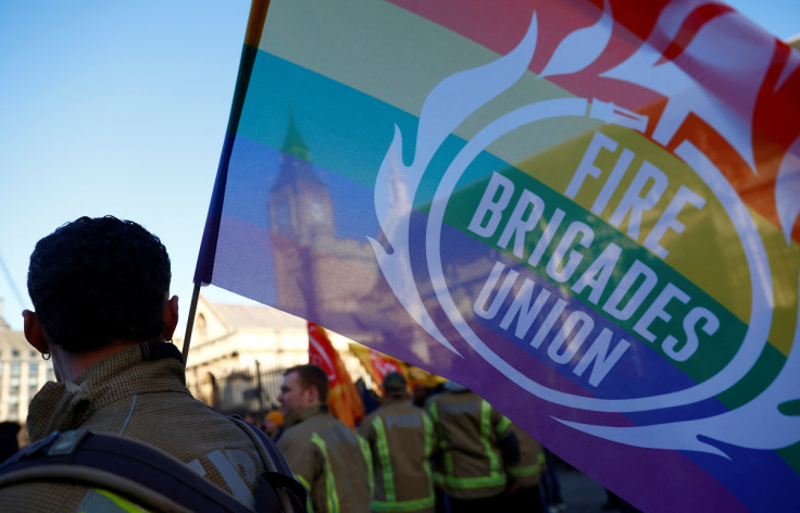 Members of the Fire Brigades Union take part in a rally regarding possible future strike action linked to a pay dispute, in London