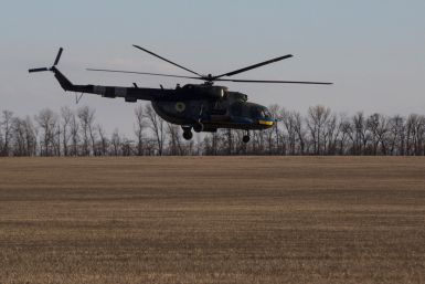 Ukrainian Armed Forces helicopter flies over a field outside the frontline town of Bakhmut