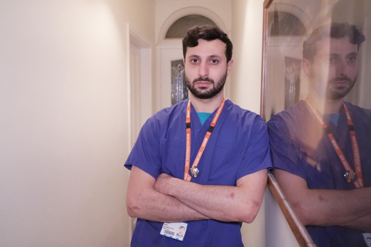 Junior Doctor Daniel Zahedi poses in his house share in Cambridge