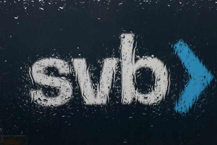 The Silicon Valley Bank (SVB) logo is seen through a rain covered window in front of the SVB headquarters on March 10, 2023 in Santa Clara, California