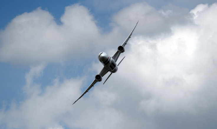 A Boeing 787 puts on a display at the Farnborough Airshow, in Farnborough