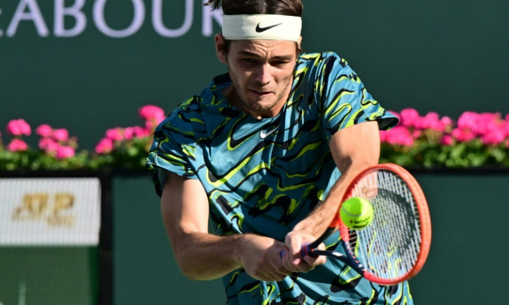 Quick work: Defending champion Taylor Fritz of the United States on the way to a 6-1, 6-2 victory over Argentina's Sebastian Baez in the third round at Indian Wells