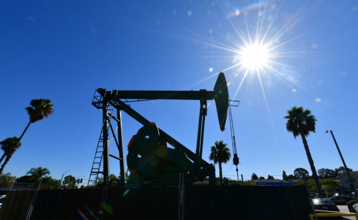 Oil prices were up Wednesday but remain under pressure over worries about a possible recession