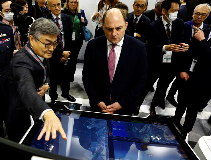 British Defence Secretary Ben Wallace visits Japan's Mitsubishi Heavy Industries' booth at the DSEI Japan defense show at Makuhari Messe in Chiba