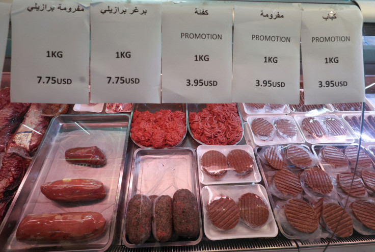 Signs show prices of meat in U.S. dollars at a supermarket in Beirut