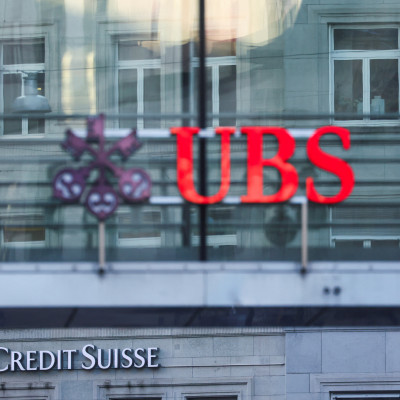 Logos of Swiss banks UBS and Credit Suisse are seen in Zurich