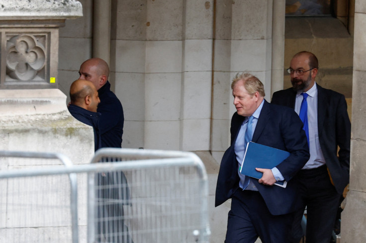 Former British PM Johnson walks at the parliament in London