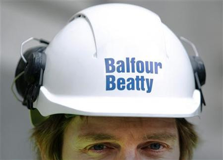 A Balfour Beatty worker walks onto a site in London A Balfour Beatty worker walks onto a site in London
