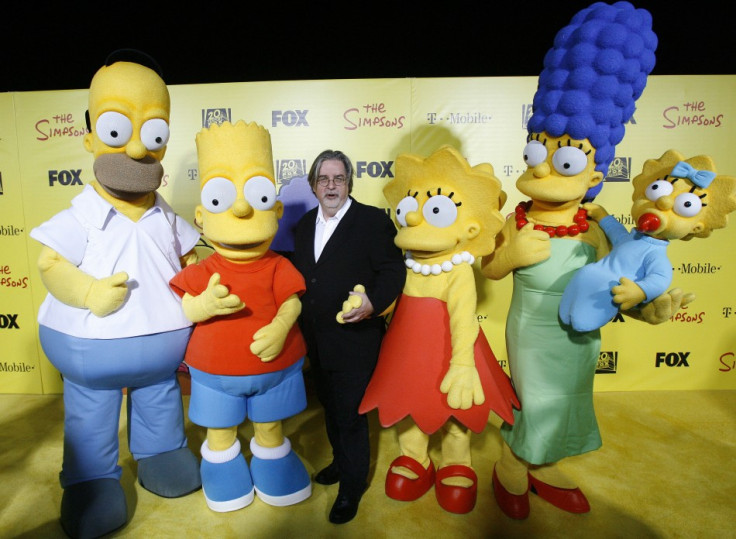 Matt Groening, creator of The Simpsons, poses with characters from show