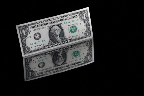 A U.S. one dollar banknote is seen in this illustration