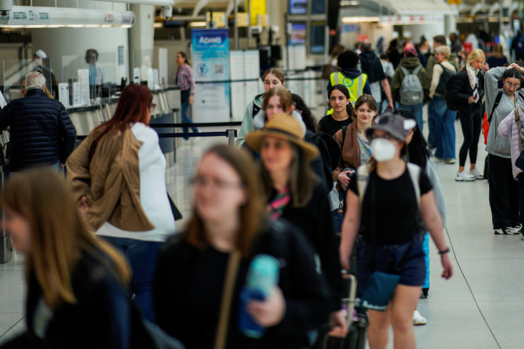 Travelers walk at John F. Kennedy International Airport in New York