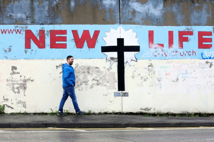 The Peace wall in west Belfast still separates the Catholic and Protestant communities