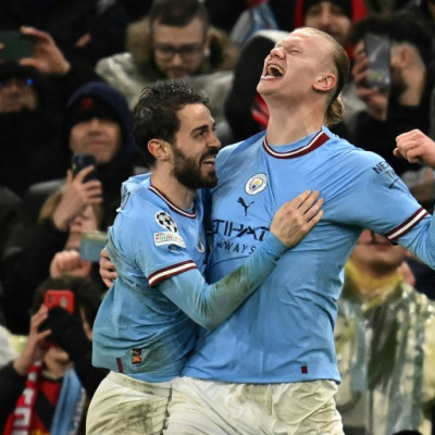 Erling Haaland (right) scored his 45th goal of the season in Manchester City's win over Bayern Munich