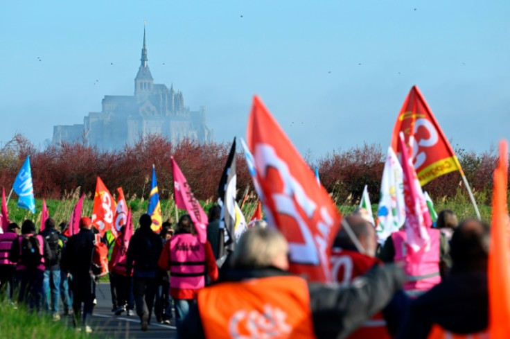 Protestor try to block Le-Mont-Saint-Michel during a demonstration against the government's pensions reform on April 7