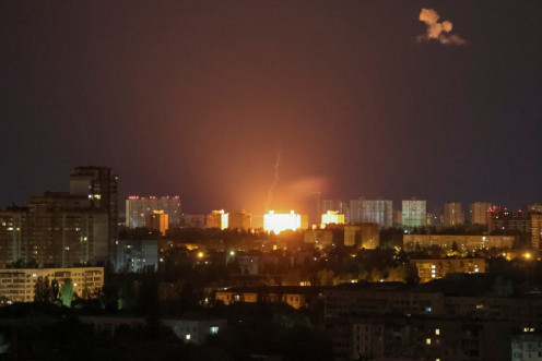 An explosion of a drone is seen during a Russian drone strike in Kyiv