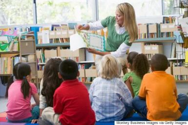 Teacher reading to children