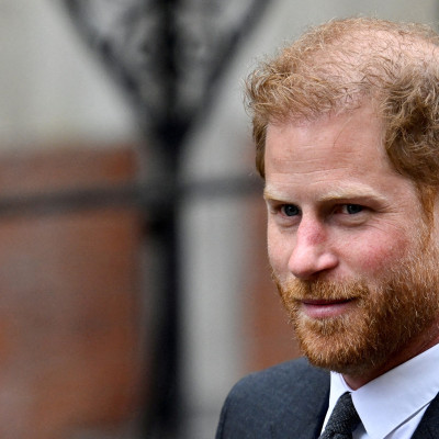 Britain's Prince Harry walks outside the High Court, in London