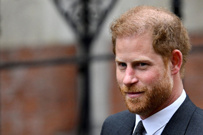 Britain's Prince Harry walks outside the High Court, in London