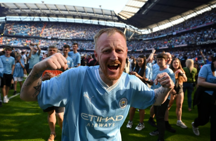Manchester City fans invaded the pitch in celebration at clinching the Premier League title