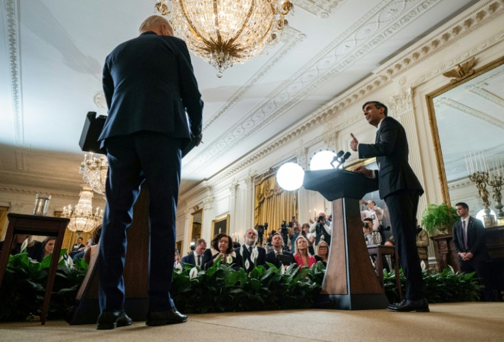 US President Joe Biden and British Prime Minister Rishi Sunak leave the East Room of the White House following a joint press conference