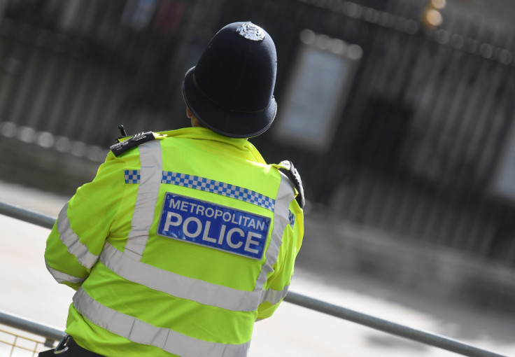 A Metropolitan Police officer stands on duty