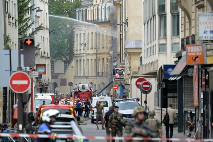 The blast was followed by a major fire which caused a building, housing a fashion school, to collapse