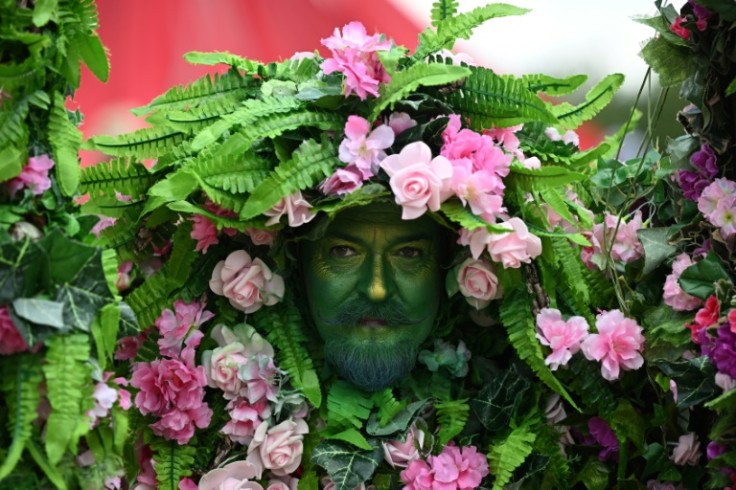A performer entertains festivalgoers in the circus field on day three of the Glastonbury festival