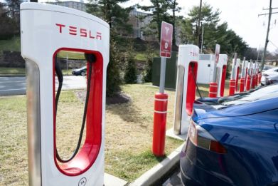 The embrace of Tesla's electric vehicle charging network has raised questions about whether it will supplant a rival system and become the national standard