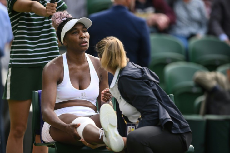 Pain game: Venus Williams receives treatment for a leg injury against Elina Svitolina
