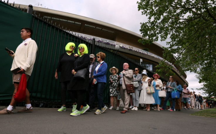 Game of patience: Fans queue to enter the venue