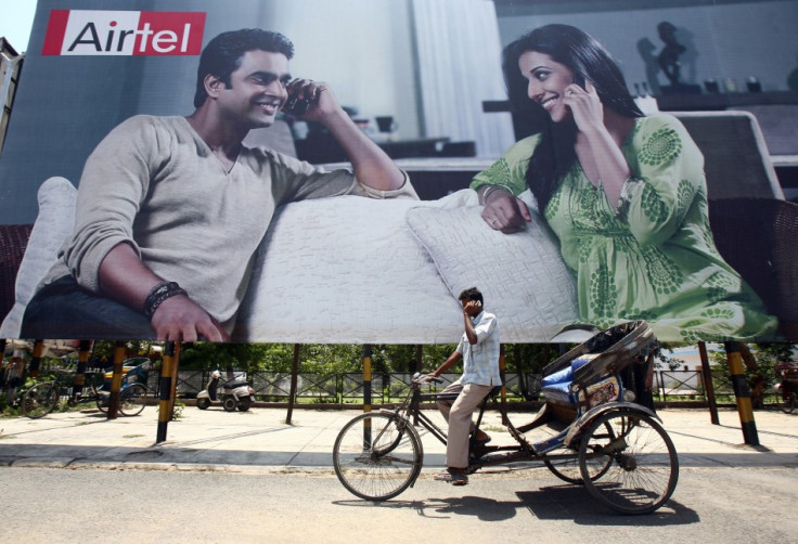 Rickshaw driver talks on his mobile phone in Chandigarh