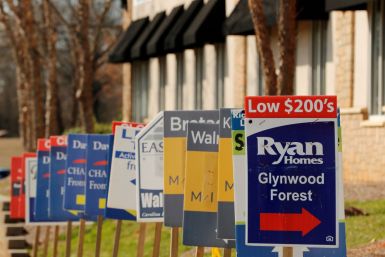Real estate signs advertise new homes for 