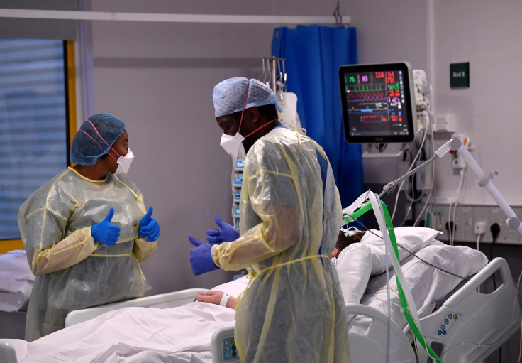 Neurosurgeons examining a patient