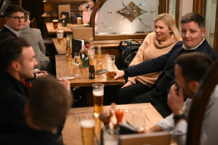 People in a pub chatting